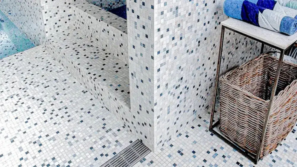Mosaic bathhouse detail with precise mitred edge work.