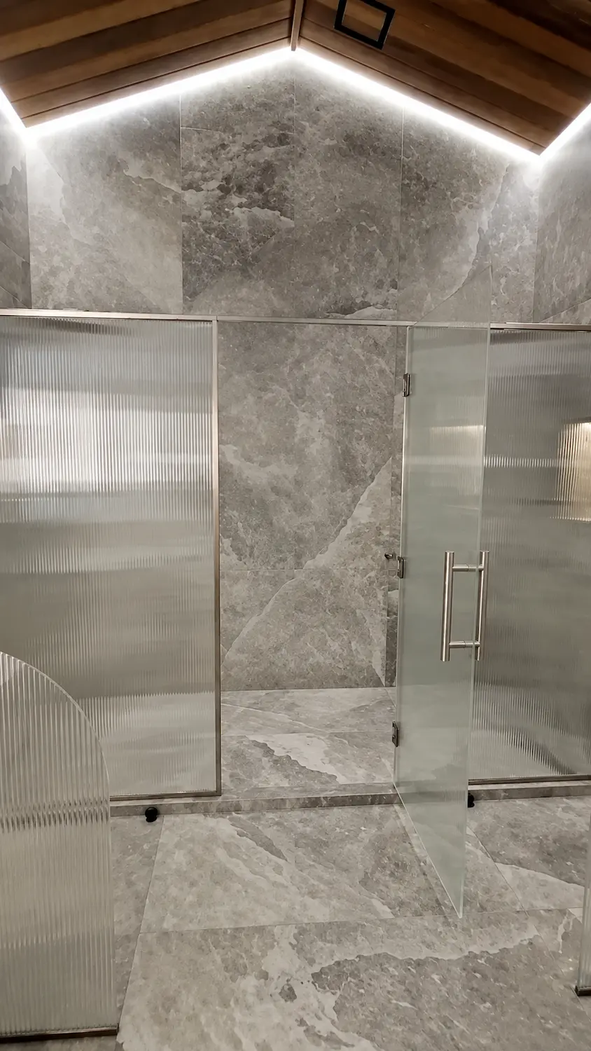 Large format ensuite video poster showing refined tile installation