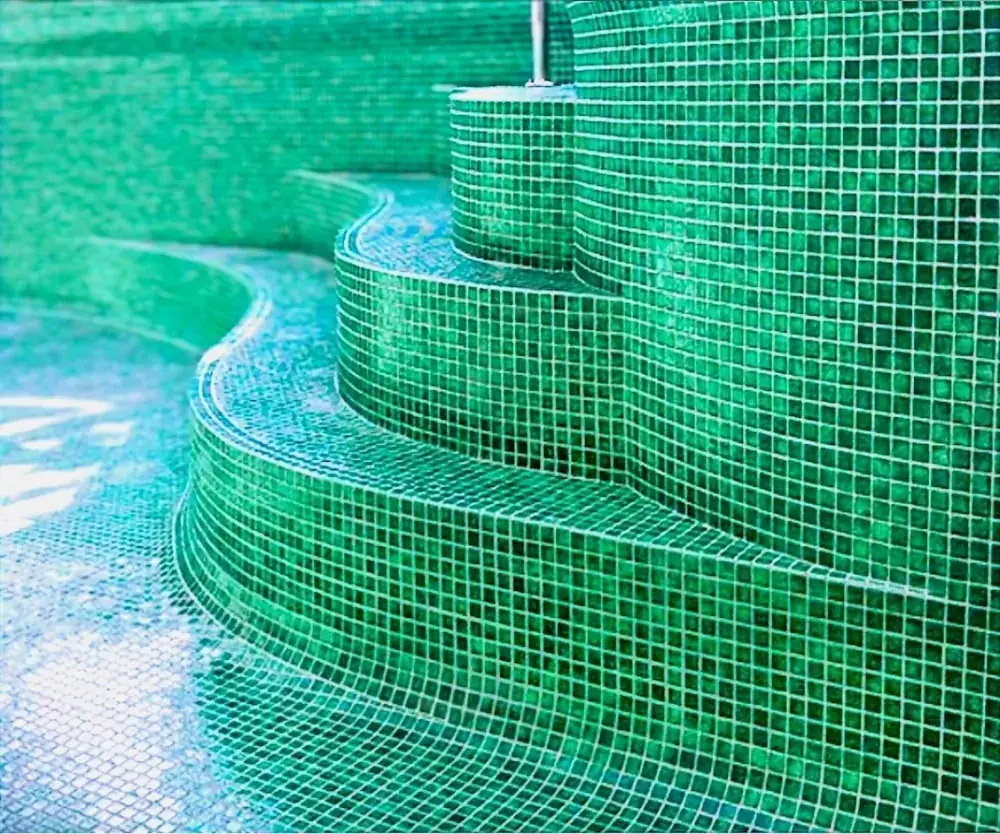 Green glass mosaic pool steps showing wet area grout detail