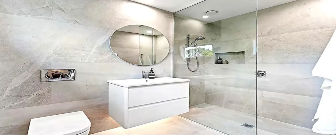 Natural stone bathroom with floating vanity