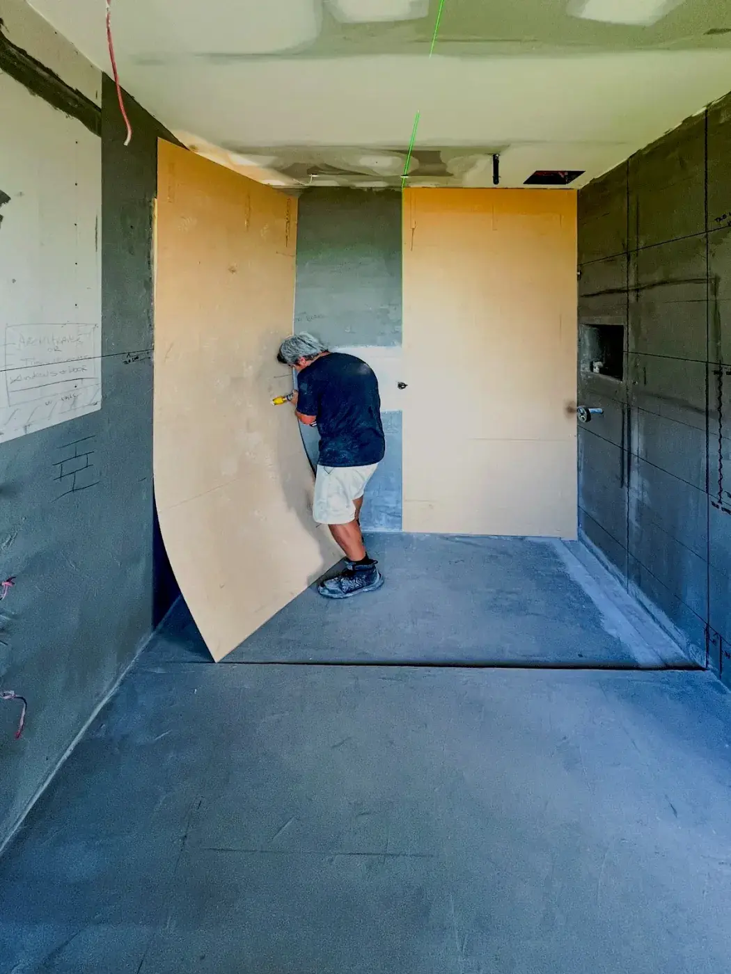 Large format stone slab shower templating and installation in Auckland