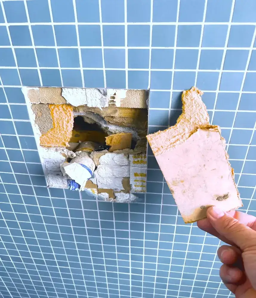 Glass mosaic plunge pool with floor-to-ceiling mosaic surfaces.