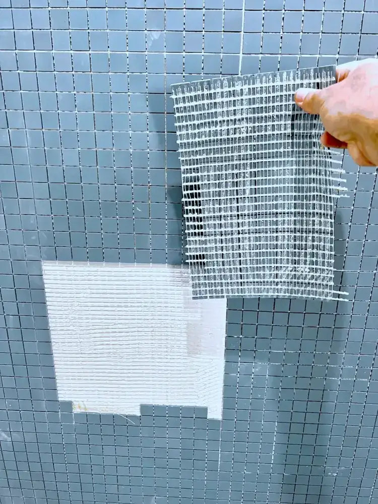 Levelled mosaic floor tile installation demonstrating surface accuracy.